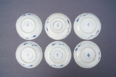 Twelve Chinese blue and white cups and saucers with floral design, Kangxi/Qianlong