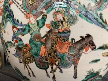 A large Chinese famille verte fish bowl with a narrative scene all-round, 19th C.