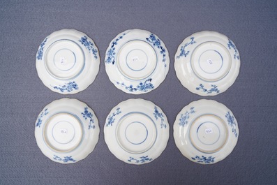 Twelve Chinese blue and white cups and saucers with floral design, Kangxi/Qianlong