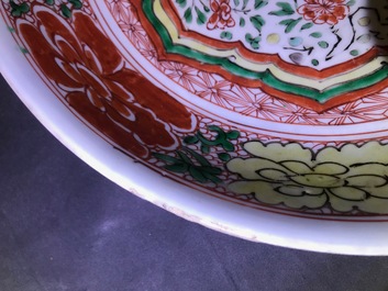 A Chinese famille verte dish and a monochrome green plate, Kangxi