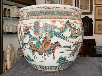 A large Chinese famille verte fish bowl with a narrative scene all-round, 19th C.