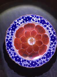 Four Chinese blue, white and iron red 'lotus' plates, Qianlong/Jiaqing