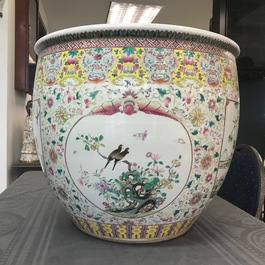 A large Chinese famille rose fish bowl with birds among flowers, 19th C.