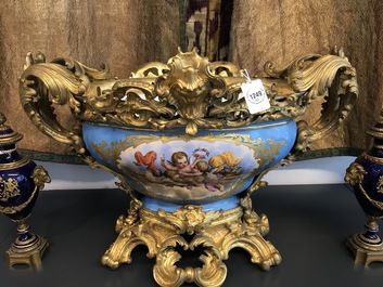 A pair of massive gilt bronze-mounted S&egrave;vres porcelain ewers and a jardini&egrave;re, France, 19th C.