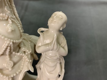 Two Chinese Dehua blanc de Chine models of a Luohan and Guanyin with servant, 19th C.