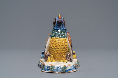 A polychrome Dutch Delft group of a hen with chickens, 18th C.