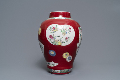 A fine Chinese famille rose ruby ground baluster vase with floral panels, Yongzheng