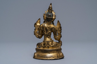 A Sino-Tibetan gilt bronze figure of Green Tara, 17/18th C.