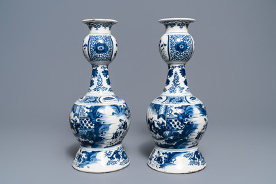 A pair of tall Dutch Delft blue and white chinoiserie vases, early 18th C.