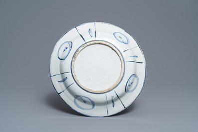 A Chinese blue and white kraak porcelain dish with figures in a landscape, Wanli