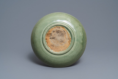 A Chinese Longquan celadon dish with underglaze peony design, Ming