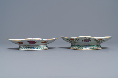 A Chinese blue and white charger and two famille rose bowls, 19th C.