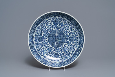 A Chinese blue and white charger and two famille rose bowls, 19th C.