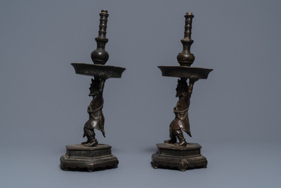 A pair of Chinese bronze candlesticks, Ming