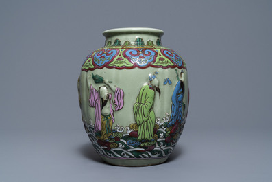 A Chinese relief-decorated famille rose celadon-ground vase, 19/20th C.