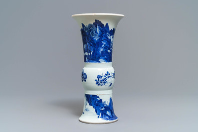 A Chinese blue and white 'gu' vase with landscape design, Kangxi mark and of the period