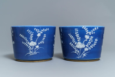 A pair of Chinese blue-ground slip-decorated jardini&egrave;res, 19th C.