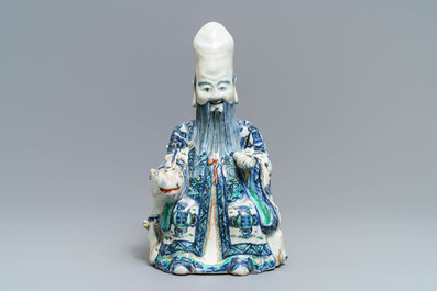 A rare Chinese wucai figure of Shoulao seated on a deer, Wanli