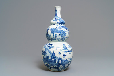 A Chinese blue and white triple gourd vase with circular landscape design, 19th C.