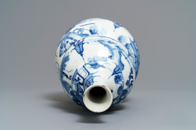 A Chinese blue and white triple gourd vase with circular landscape design, 19th C.