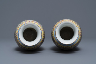 A pair of Chinese famille rose 'millefleurs' eggshell vases, Qianlong mark, Republic, 20th C.