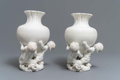 A pair of biscuit vases with young tritons, Saint-Amand or Tournai, 18th C.