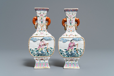 A pair of Chinese famille rose relief-decorated 'Liu Hai' vases, Qianlong mark, 19th C.