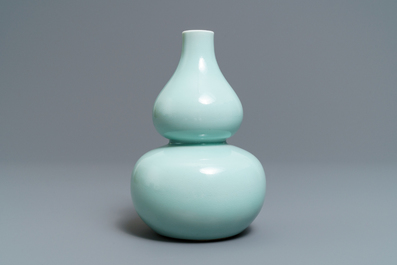 A Chinese monochrome celadon double gourd vase, Qianlong mark, 19th C.