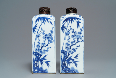 A pair of Chinese blue and white square tea caddies with landscapes and flowers, Kangxi