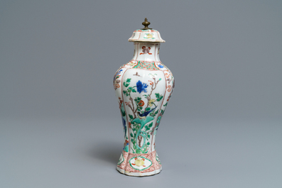 A Chinese famille verte vase and cover with mythical beasts, Kangxi