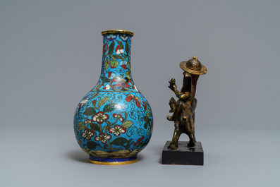 A Chinese cloisonn&eacute; bottle vase and a gilt bronze group, 18/19th C.