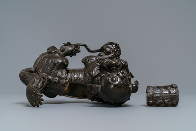 A Chinese bronze model of a Buddhist lion, Ming