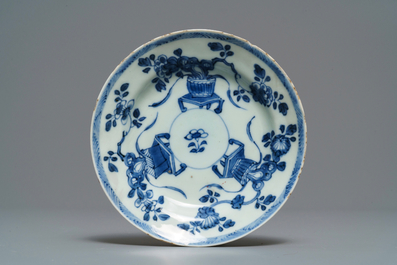 Five Chinese blue and white floral cups and saucers, Kangxi