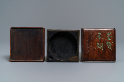 A square Chinese inscribed wood-encased duan inkstone, 19/20th C.