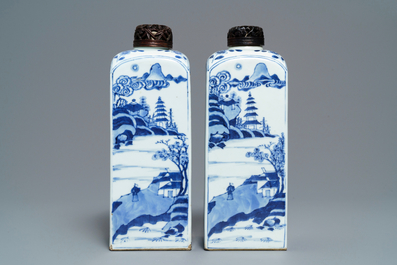 A pair of Chinese blue and white square tea caddies with landscapes and flowers, Kangxi