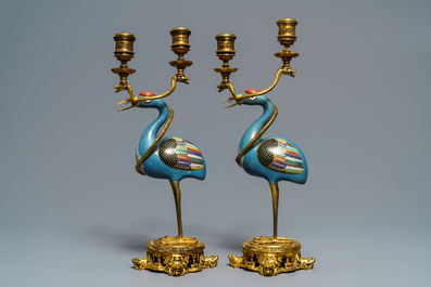 A pair of Chinese cloisonn&eacute; gilt bronze candelabra mounted cranes, 18/19th C.