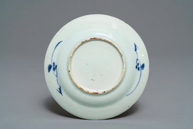 Five Chinese blue and white floral cups and saucers, Kangxi