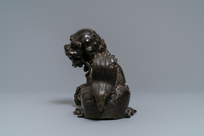 A Chinese bronze model of a Buddhist lion, Ming