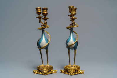 A pair of Chinese cloisonn&eacute; gilt bronze candelabra mounted cranes, 18/19th C.