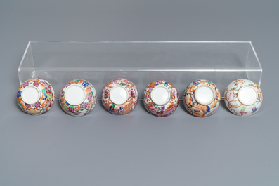 Eleven Chinese famille rose 'mandarin' cups, eight saucers, a teapot and a vase, Qianlong