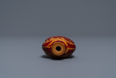 A Chinese carved realgar glass snuff bottle, Imperial Glassworks, Beijing, 1730-1840