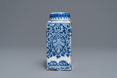 A Dutch Delft blue and white tea caddy with screw cap, late 17th C.