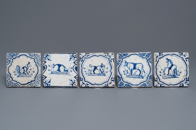 Fifteen Dutch Delft blue and white tiles with horseriders and animals, 17/18th C.