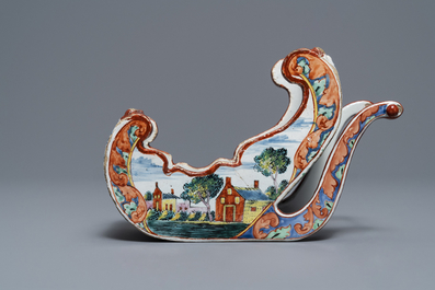 A polychrome petit feu Dutch Delft pipe stand modelled as a sledge, 18th C.