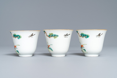 Three Chinese famille verte 'deer and monkey' cups and saucers, Tongzhi mark and of the period