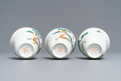 Three Chinese famille verte 'deer and monkey' cups and saucers, Tongzhi mark and of the period