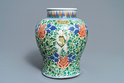 A Chinese wucai 'boys and peony scrolls' vase, 19th C.