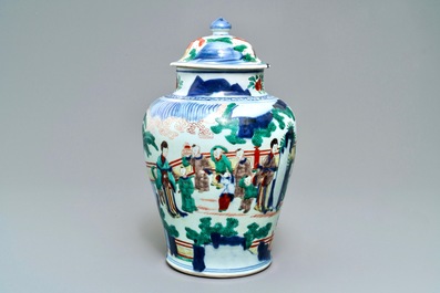 A Chinese wucai baluster vase and cover with playing boys, Transitional period