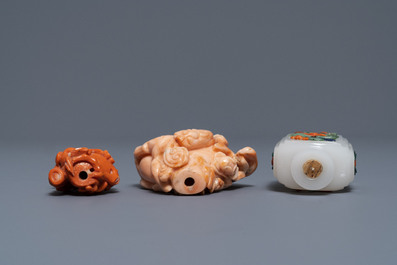 Two Chinese coral snuff bottles and one coral-embellished glass bottle, 19/20th C.