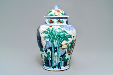 A Chinese wucai baluster vase and cover with playing boys, Transitional period